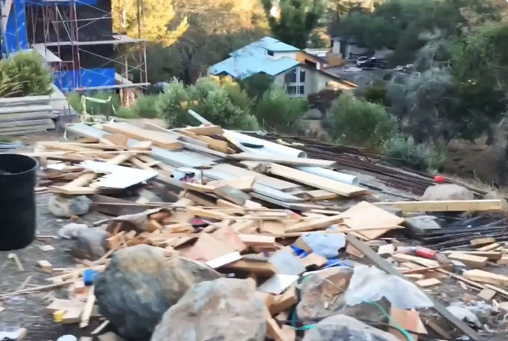 Construction site wood and rebar debris ready for removal