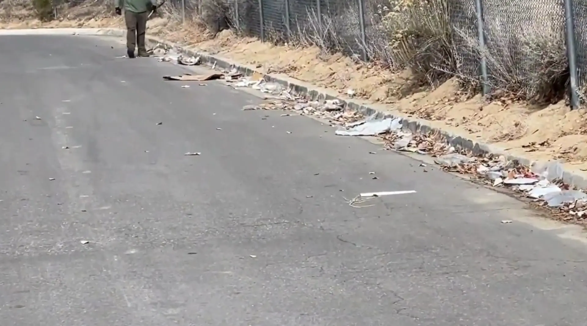 Residential junk removal crew clearing debris along a property walkway